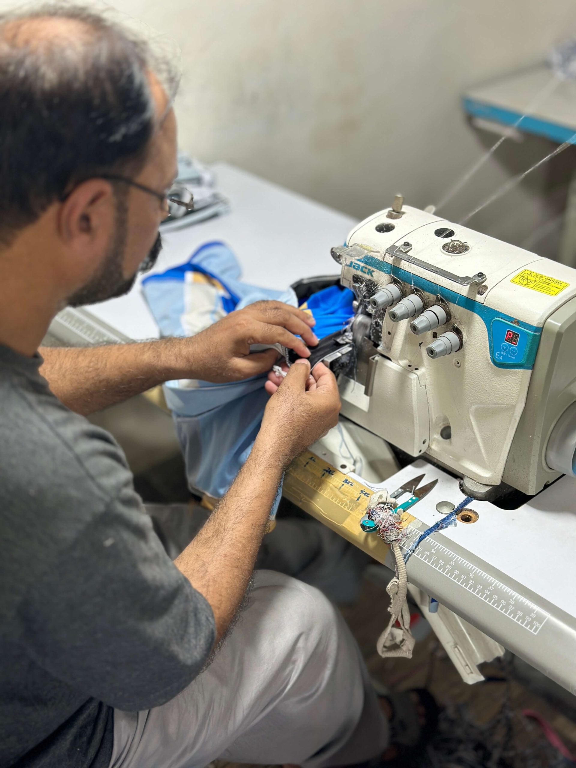 Cut and stitched kit with flatlock seams